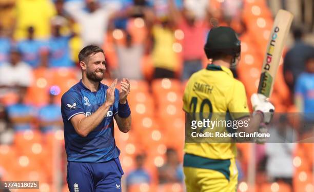 Chris Woakes of England celebrates the wicket of David Warner of Australia during the ICC Men's Cricket World Cup India 2023 between England and...