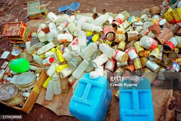 recycling old tin cans and plastic bottles - ethiopia city stock pictures, royalty-free photos & images