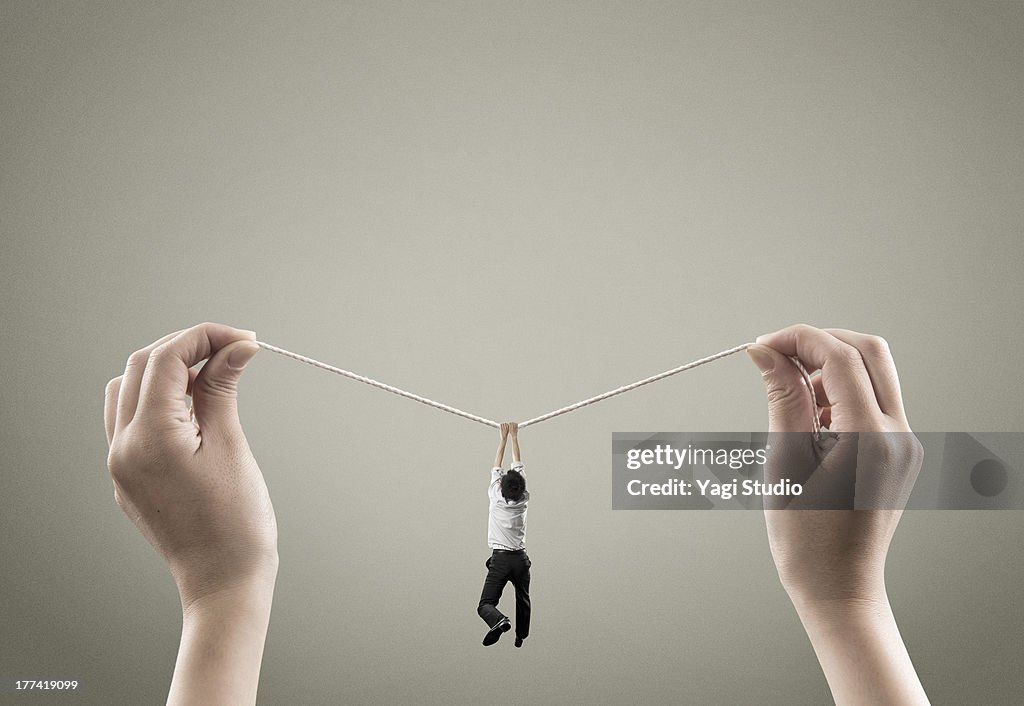 Man hold on to rope