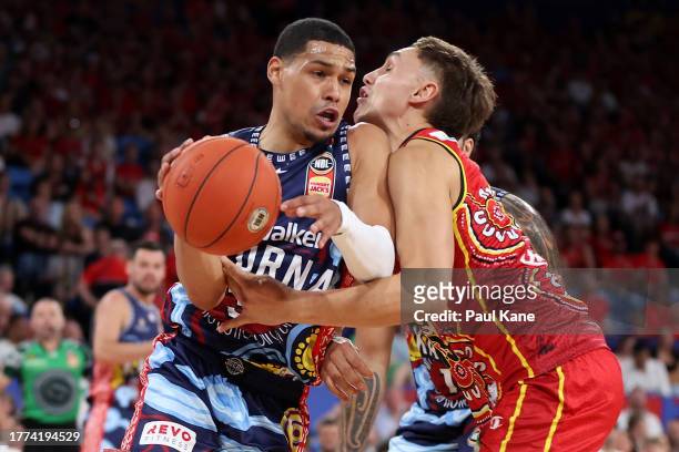Trey Kell of the 36ers is fouled by Hyrum Harris of the Wildcats during the round six NBL match between Perth Wildcats and Adelaide 36ers at RAC...