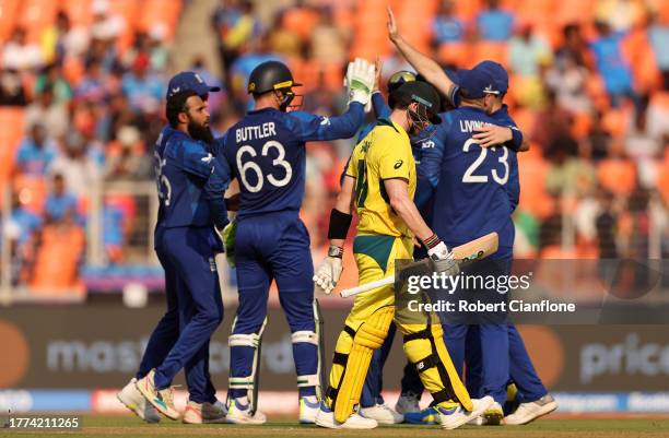 Adil Rashid of England celebrates the wicket of Steve Smith of Australia during the ICC Men's Cricket World Cup India 2023 between England and...