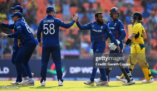 Adil Rashid of England celebrates the wicket of Steve Smith of Australia during the ICC Men's Cricket World Cup India 2023 between England and...