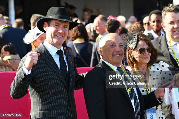 Trainer Ciaron Maher poses with connections Tony Ottobre after Pride of Jenni won Race 8, the Tab Empire Rose Stakes, during Derby Day at Flemington...