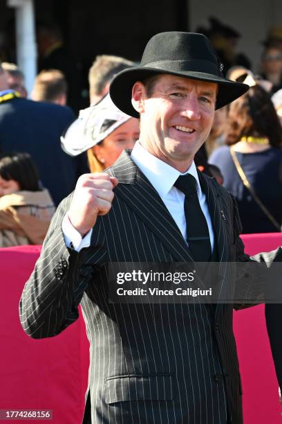 Trainer Ciaron Maher poses with connections Tony Ottobre after Pride of Jenni won Race 8, the Tab Empire Rose Stakes, during Derby Day at Flemington...