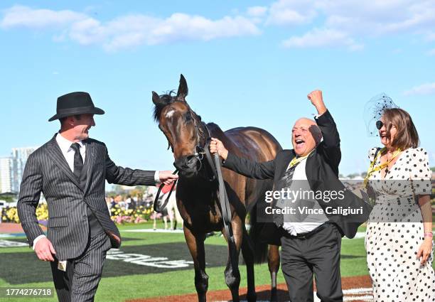 Trainer Ciaron Maher poses with connections Tony Ottobre after Pride of Jenni won Race 8, the Tab Empire Rose Stakes, during Derby Day at Flemington...