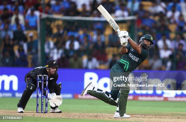 Fakhar Zaman of Pakistan plays a shot as Tom Latham of New Zealand keeps during the ICC Men's Cricket World Cup India 2023 between New Zealand and...