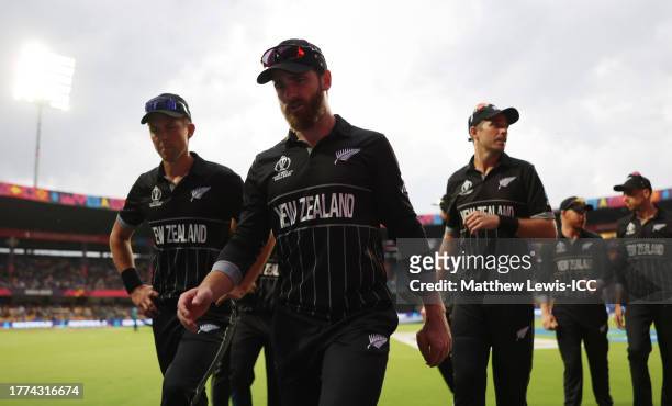 Kane Williamson of New Zealand leads their side off as rain delays play during the ICC Men's Cricket World Cup India 2023 between New Zealand and...