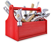 Red wooden toolbox with tools on white background