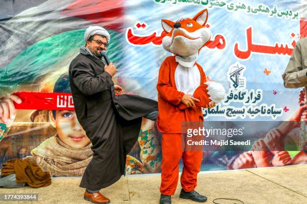 Iranians participate in a march in front of the former American embassy in Tehran, to support the Palestinians of the Gaza Strip and on the occasion...