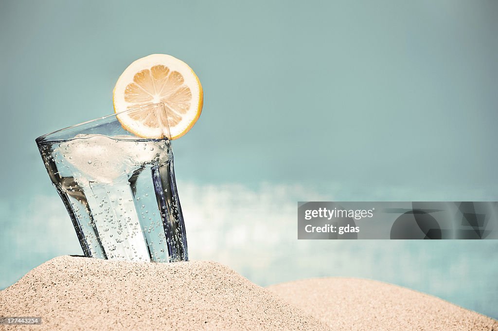 Hot summer day and cold drink on the beach