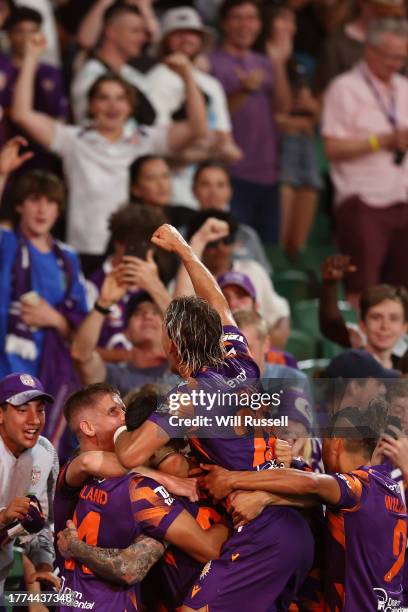 Adam Taggart of the Glory celebrates with team mates after scoring a goal during the A-League Men round three match between Perth Glory and Central...