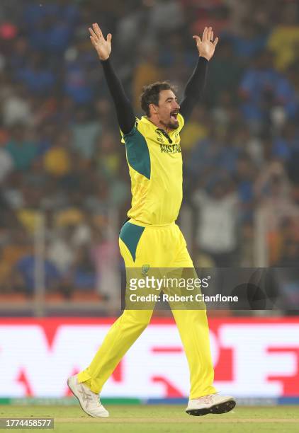 Mitchell Starc of Australia celebrates the wicket of Jonny Bairstow of England during the ICC Men's Cricket World Cup India 2023 between England and...