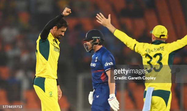Mitchell Starc of Australia celebrates the wicket of Jonny Bairstow of England during the ICC Men's Cricket World Cup India 2023 between England and...