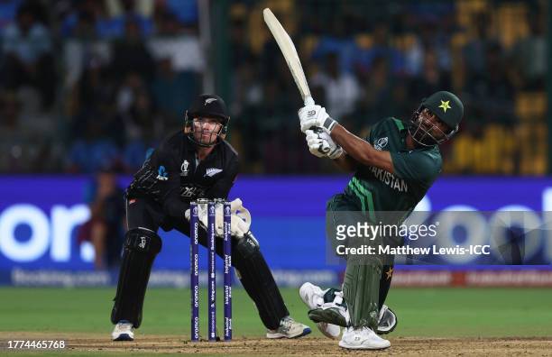 Fakhar Zaman of Pakistan plays a shot as Tom Latham of New Zealand keeps during the ICC Men's Cricket World Cup India 2023 between New Zealand and...
