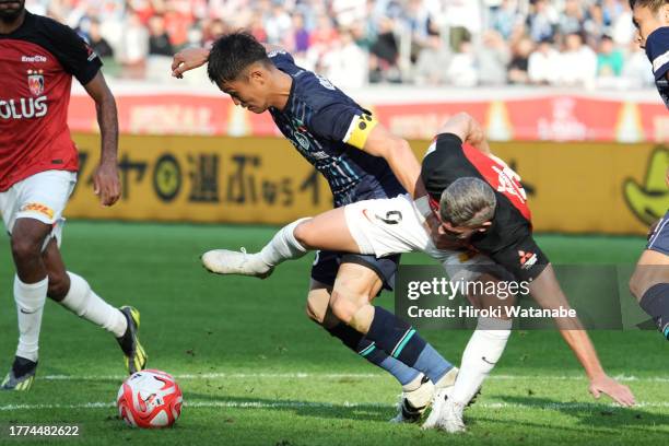 Tatsuki Nara of Avispa Fukuoka and Bryan Linssen of Urawa Red Diamonds compete for the ball during the J.LEAGUE YBC Levain Cup final between Avispa...