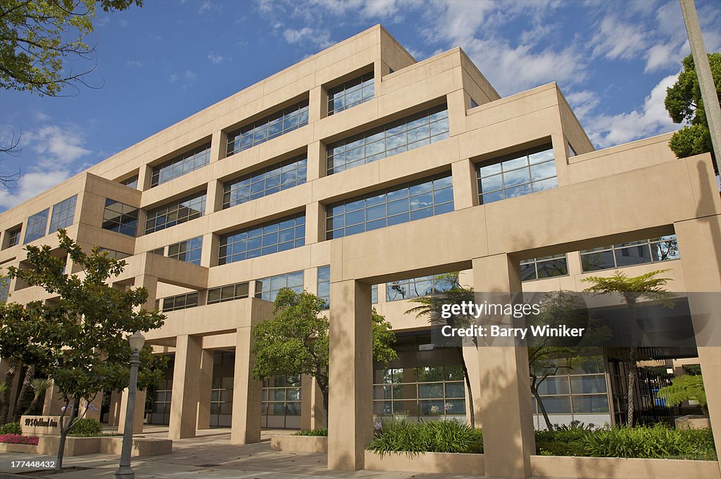 Beige building with projecting posts and lintels.