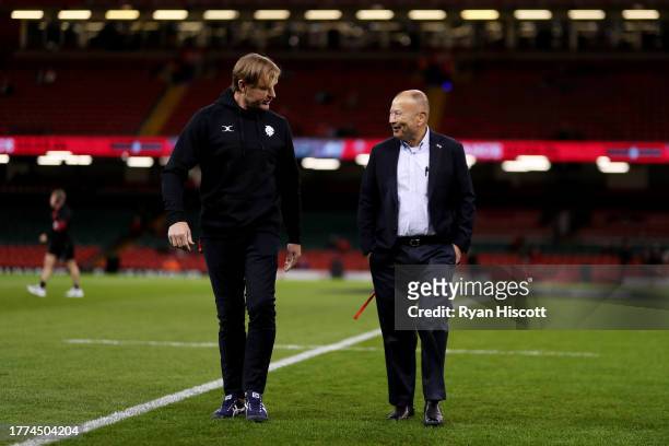 Scott Robertson, Coach of Barbarians, speaks with Eddie Jones, Coach of Barbarians, as they inspect the pitch prior to the Test Match between Wales...
