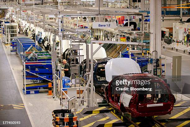 Automobile chassis move along on the production line during the early stages of assembly at the Volvo Cars plant in Torslanda, Sweden, on Thursday,...