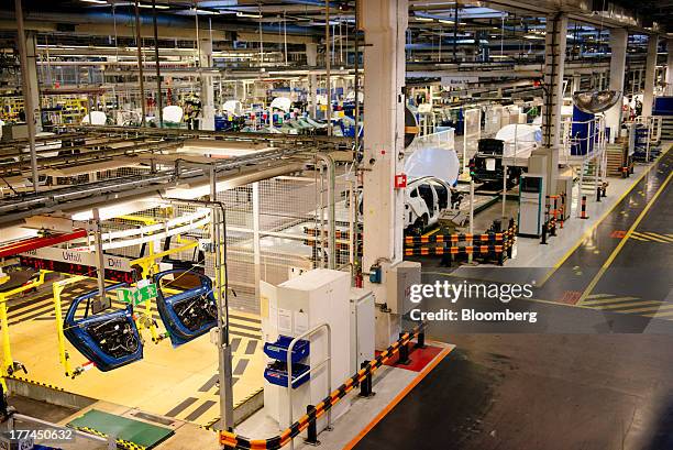 Vehicle doors hang on the production floor at the Volvo Cars plant in Torslanda, Sweden, on Thursday, Aug. 22, 2013. Volvo Cars Chief Executive...