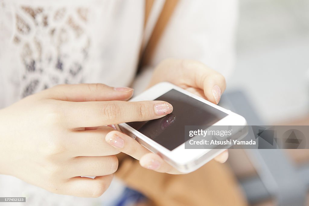 Young woman using smartphone,Close-up