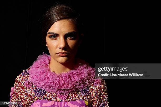 Model poses backstage ahead of the MBFWA Trends show during Mercedes-Benz Fashion Festival Sydney 2013 at Sydney Town Hall on August 23, 2013 in...