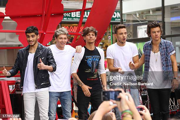 Singers Zayn Malik, Niall Horan, Louis Tomlinson, Liam Payne and Harry Styles from One Direction perform on stage on NBC's "Today" at Rockefeller...