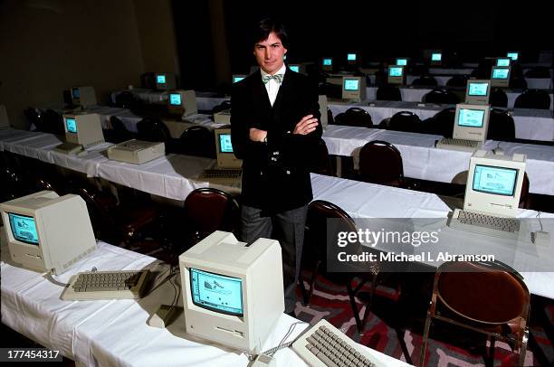 Steve Jobs with room full of computers, 1984.