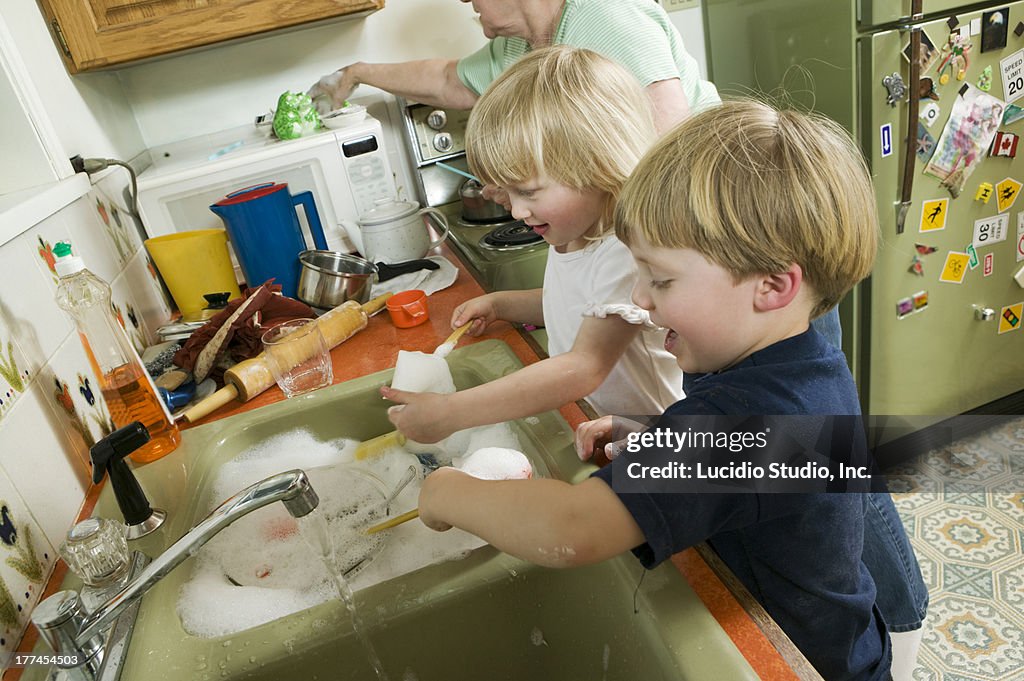 Young Children Helping With the Dishes.