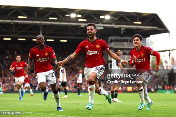 Bruno Fernandes of Manchester United celebrates after scoring the team's first goal during the Premier League match between Fulham FC and Manchester...