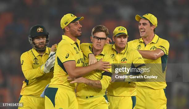 Adam Zampa of Australia celebrates the wicket of Jos Buttler of England during the ICC Men's Cricket World Cup India 2023 between England and...