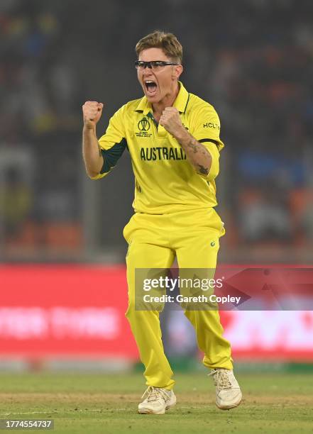 Adam Zampa of Australia celebrates the wicket of Jos Buttler of England during the ICC Men's Cricket World Cup India 2023 between England and...