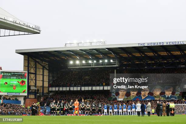 Players, match officials and fans take part in a minute's silence for the upcoming armistice day prior to the Premier League match between Everton FC...