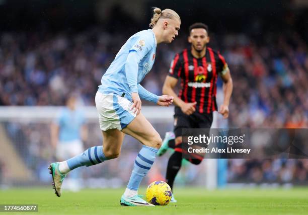 Erling Haaland of Manchester City runs with the ball during the Premier League match between Manchester City and AFC Bournemouth at Etihad Stadium on...