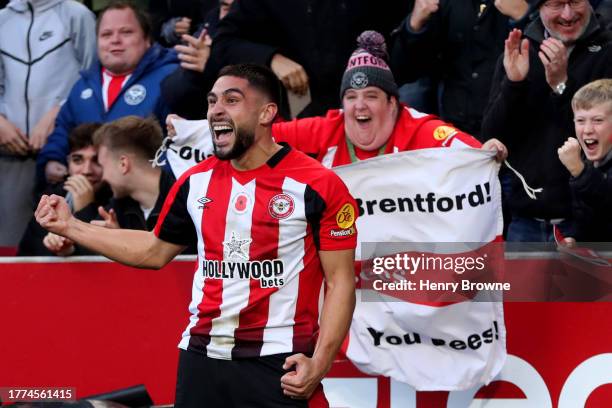 Neal Maupay of Brentford celebrates after scoring the team's first goal during the Premier League match between Brentford FC and West Ham United at...