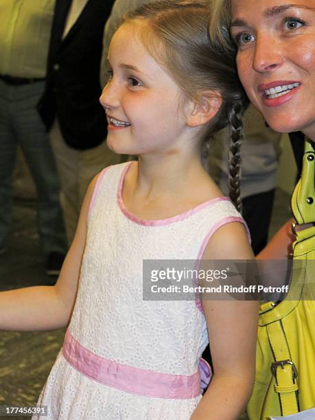 Year-old violin prodigy, Alma Deutscher poses with a guest after Alma performed a piece of her own composition alongside the New Russian Quartet as...