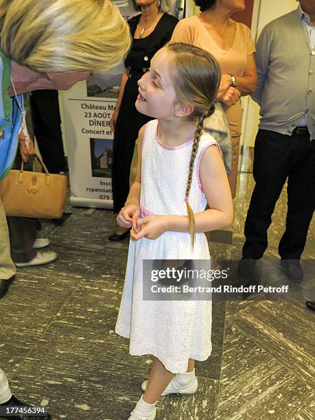English 8-year-old violin prodigy, Alma Deutscher talks with a spectator after she performed a piece of her own composition alongside the New Russian...