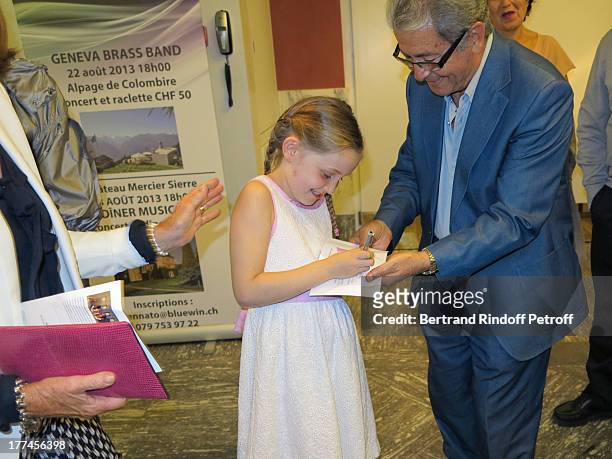 Year-old violin prodigy, Alma Deutscher signs autographs after performing a piece of her own composition alongside the New Russian Quartet as part of...