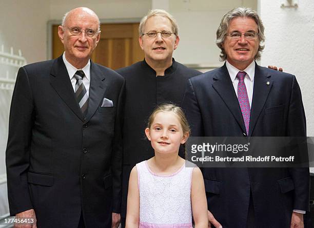 English 8-year-old violin prodigy, Alma Deutscher, foreground, and, President of the Crans-Montana Classics musical event, Professor Jean Bonvin,...