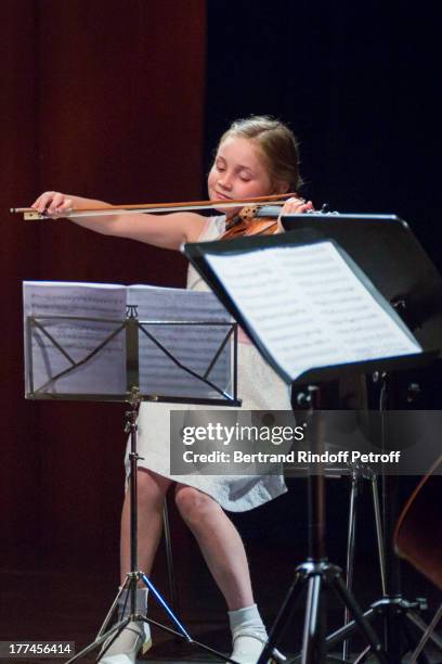 English 8-year-old violin prodigy, Alma Deutscher performs a piece of her own composition alongside the New Russian Quartet as part of the...