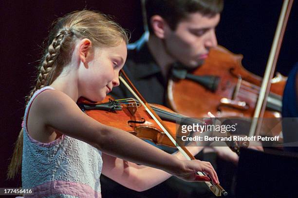 English 8-year-old violin prodigy, Alma Deutscher performs a piece of her own composition alongside violonist Michael Rudoy from the New Russian...