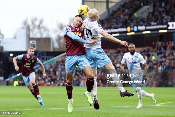 Josh Brownhill of Burnley and Will Hughes of Crystal Palace battle for a header during the Premier League match between Burnley FC and Crystal Palace...