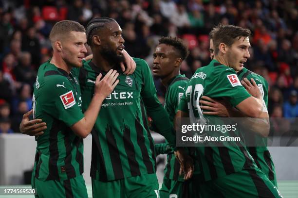 Jordan Siebatcheu of Borussia Moenchengladbach celebrates the team's second goal with teammate Nico Elvedi of during the Bundesliga match between...