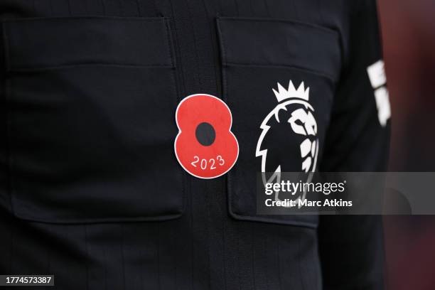 Detailed view of an Armistice Poppy on the shirt of referee, Robert Jones, during the Premier League match between Sheffield United and Wolverhampton...