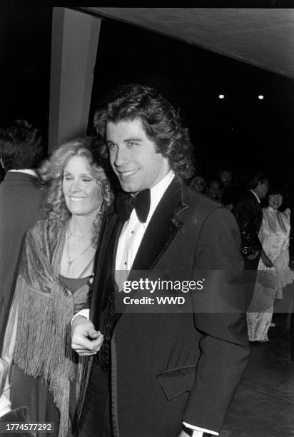 Diana Hyland and John Travolta attend an event at the Santa Monica Civic Auditorium in Santa Monica, California, on November 20, 1976.