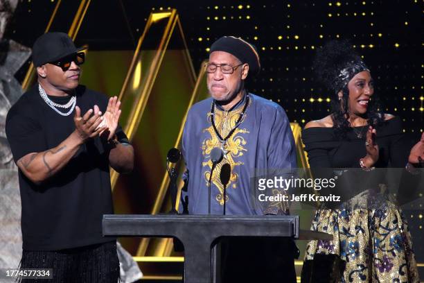 Cool J and Cindy Campbell present an award to DJ Kool Herc onstage at the 38th Annual Rock & Roll Hall Of Fame Induction Ceremony at Barclays Center...