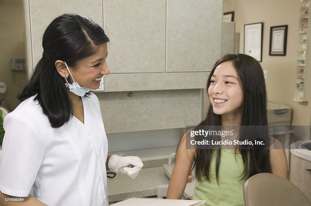 Dental professional with a young patient