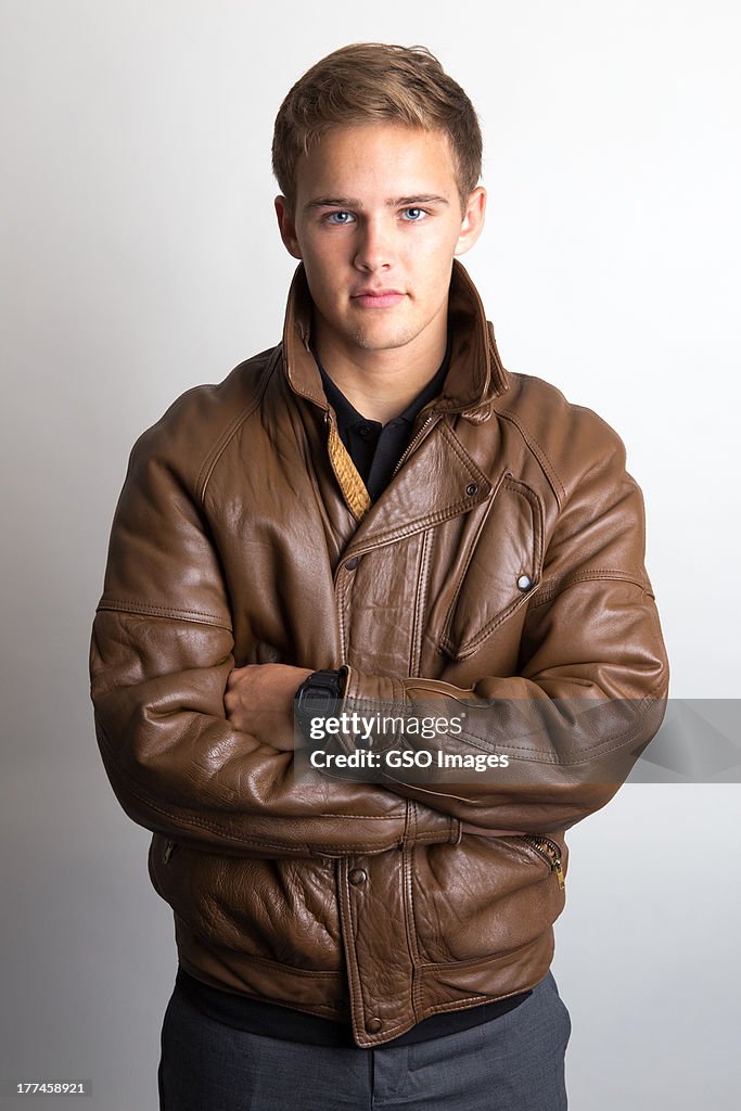 Clean cut teen youth in leather jacket