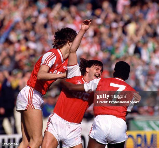 Charlie Nicholas of Arsenal celebrates after scoring with teammates including David Rocastle during the Littlewoods Challenge Football League Cup...