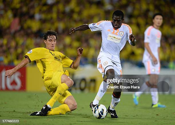 Abdulmarek Al Khaibri of Al Shabab is tackled by Cleo, whose real name is Cleverson Gabriel Cordova of Kashiwa Reysol during the AFC Champions League...