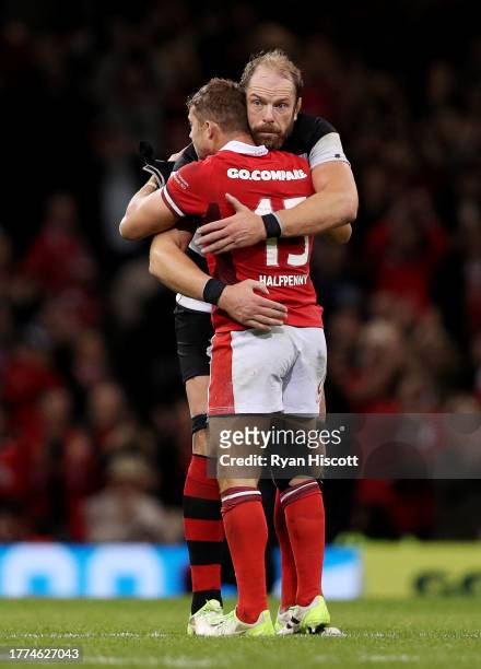 Leigh Halfpenny of Wales is embraced by Alun Wyn Jones of Barbarians, as he leaves the field whilst being substituted during his last appearance for...